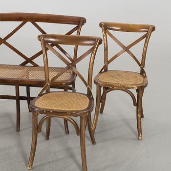 A wooden sofa, a table and four chairs, later part of the 20th century.