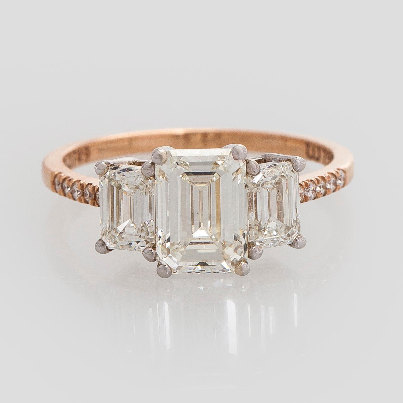 Ring, three baguette cut diamonds, small brilliant cut diamonds, 18K white gold and rose gold.