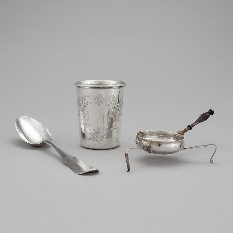 A spoon, a tea spider and a cup in silver, early to late 19th century. Total weight 143 g.