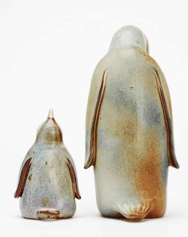 Two Gunnar Nylund stoneware figures depicting a penguin mother and child, Rörstrand.
