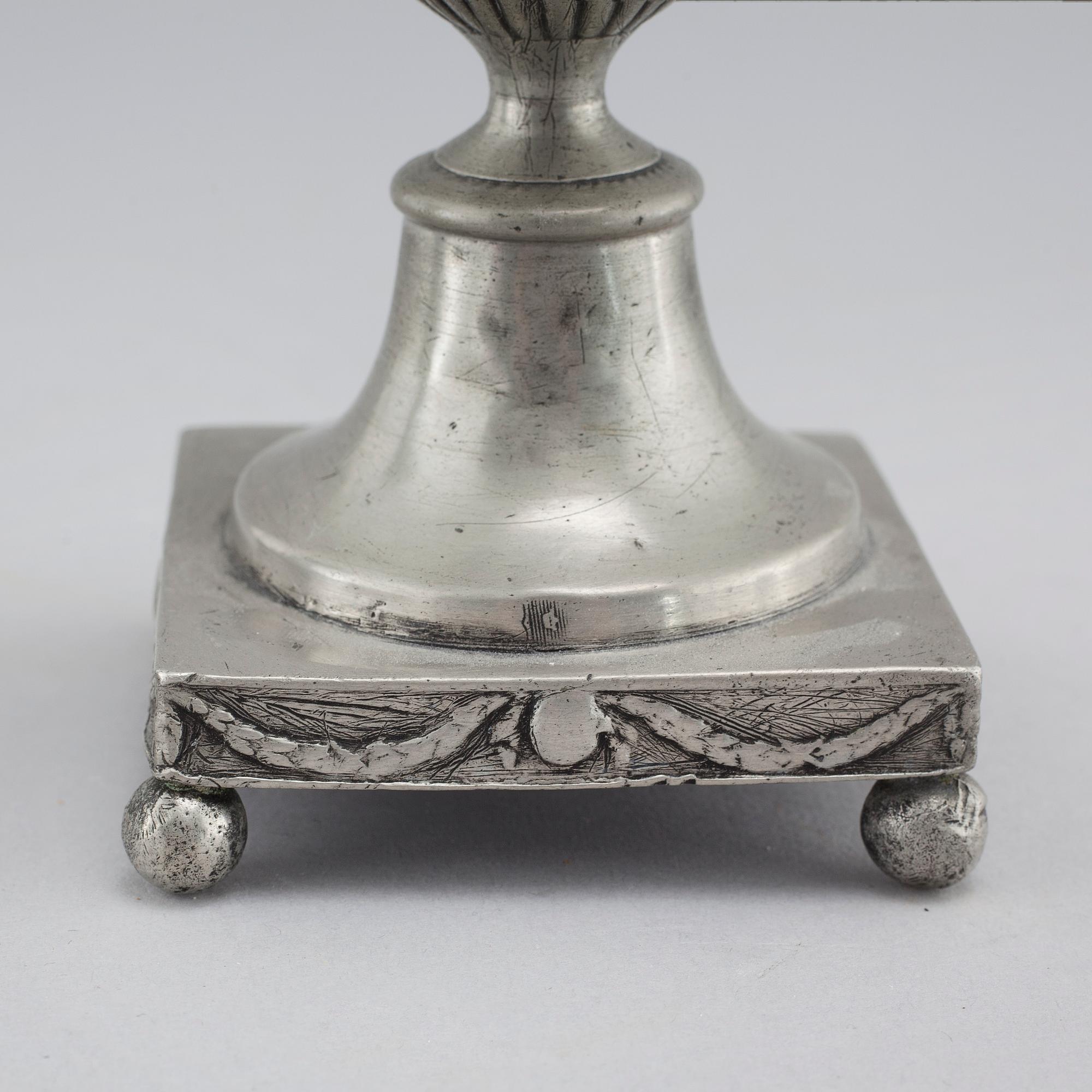 A pair of pewter candlesticks by Adolf Fredrik Moberg in Jönköping, 1824.