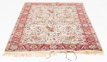 An oriental, figural rug, c. 230 x 145 cm.