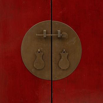 A red-lacquered cabinet, China, 20th century.