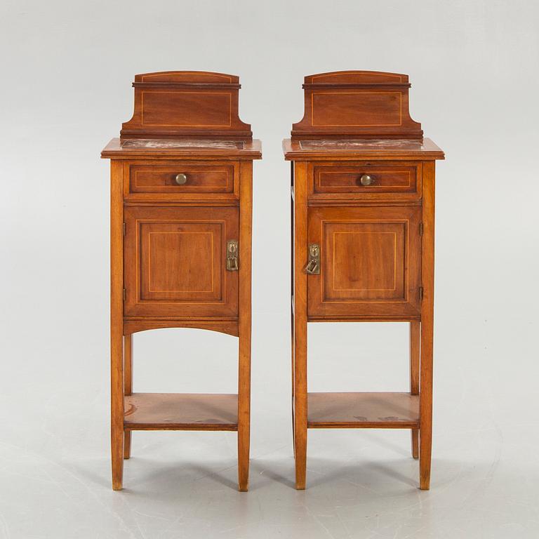 A pair of early 1900s bedside tables.