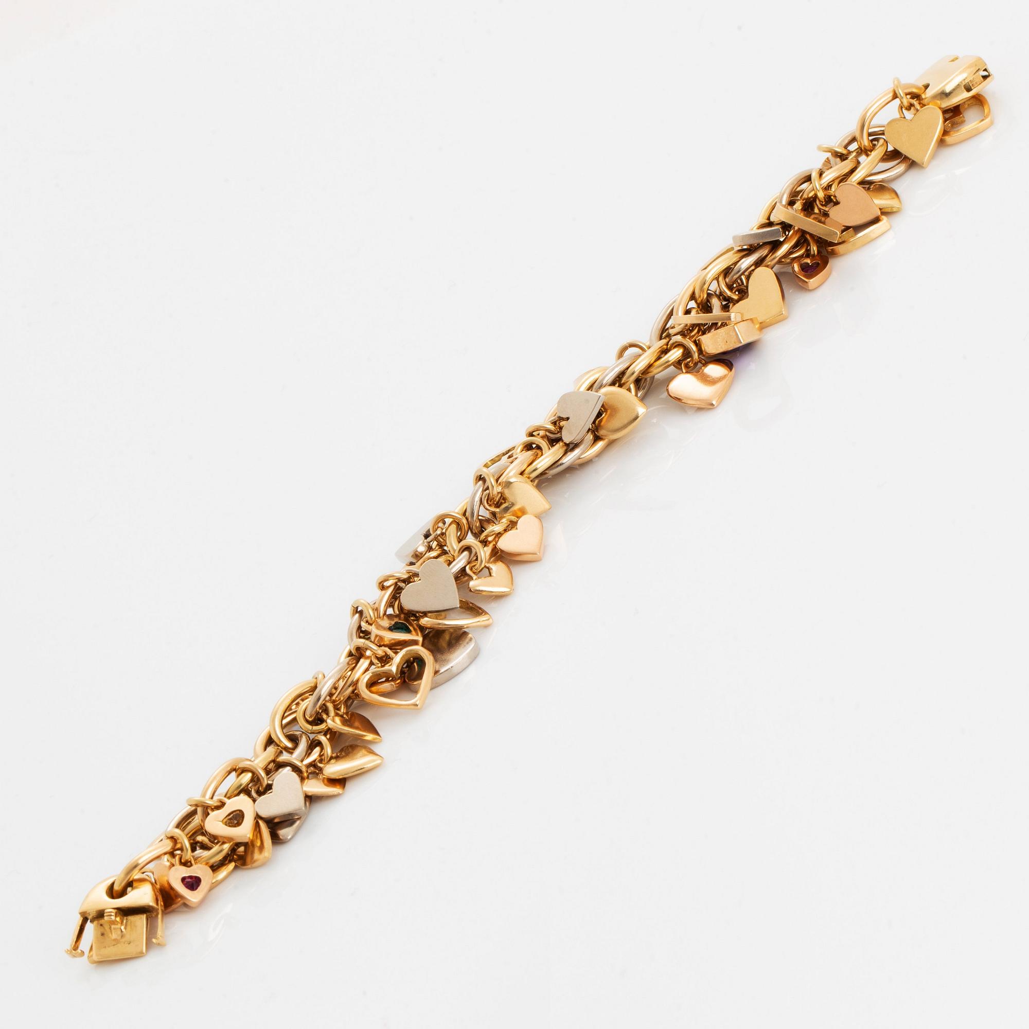 An 18K gold Gaudy bracelet with heart shaped charms.