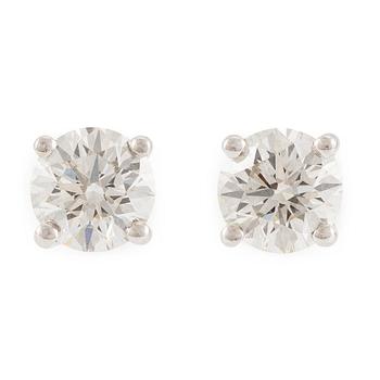 576. A pair of earrings in 18K white gold set with two round brilliant-cut diamonds, likely Tiffany & Co.