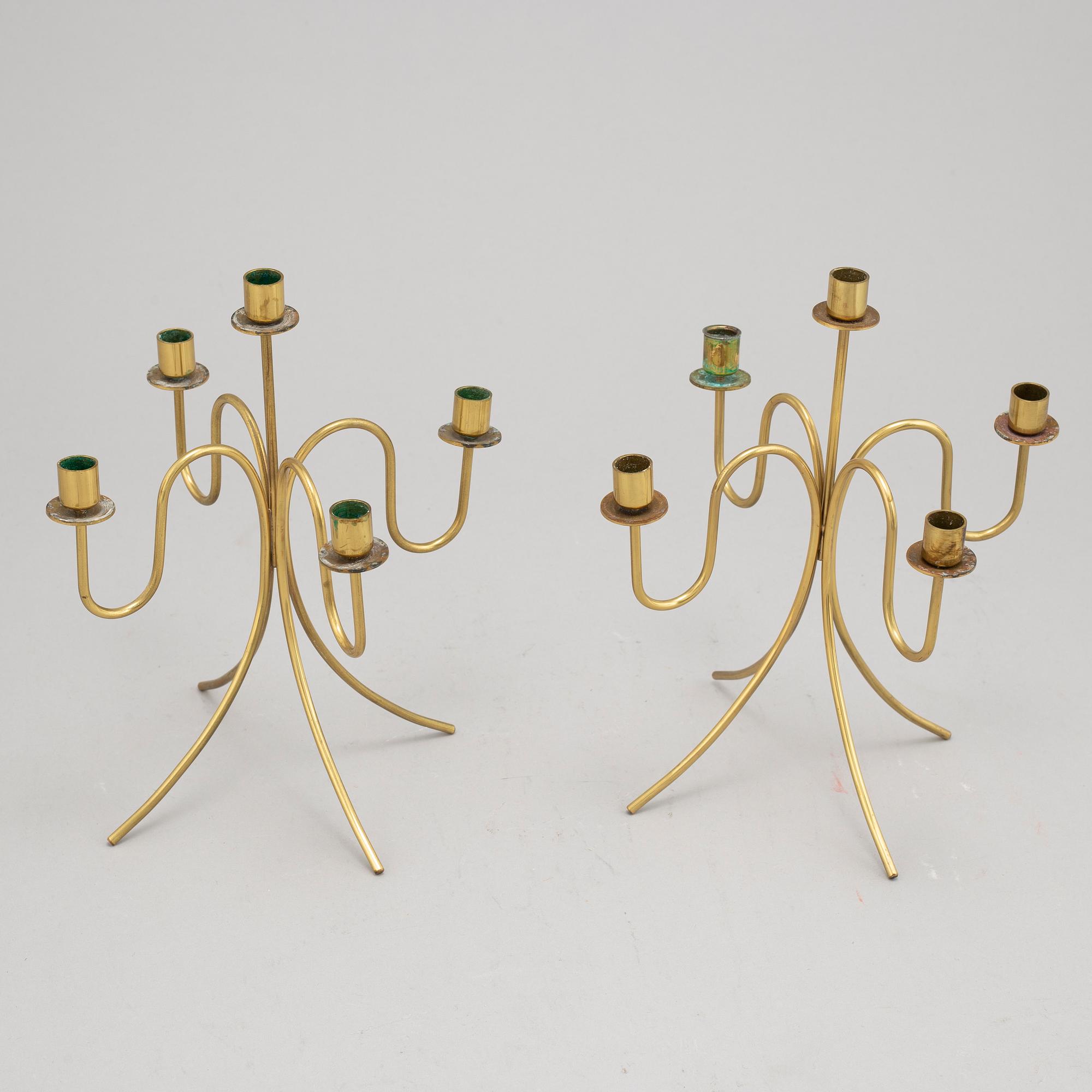 Gunnar Ander, a pair of five-light brass candelabra from Ystad Metall.