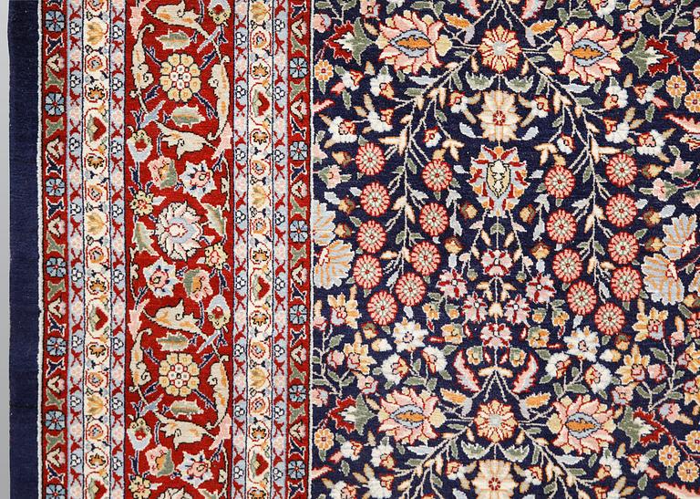 A signed Hereke carpet, ca 340 x 246 cm.