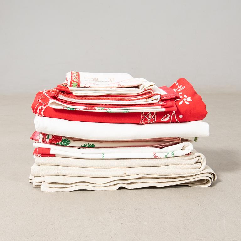 A collection of Christmas tablecloths 12 pcs first half/mid 20th century.