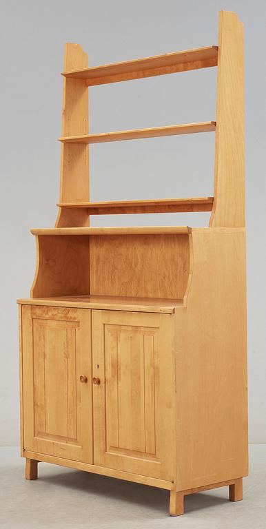 SKÅP MED HYLLA. Carl Malmsten, Åfors Möbelfabrik.