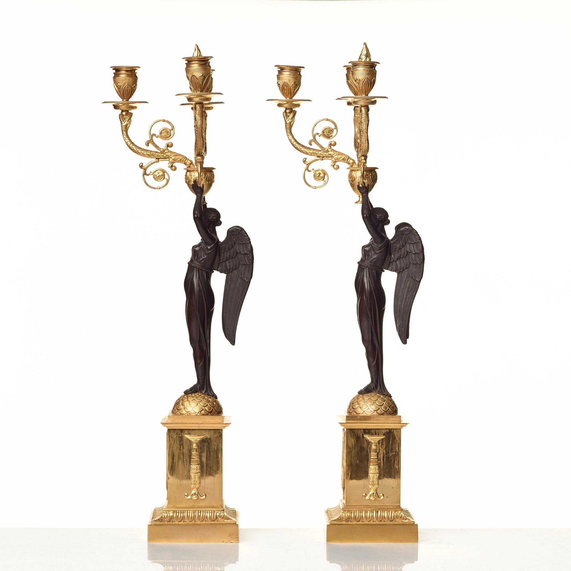 A pair of Empire three-light candelabra.