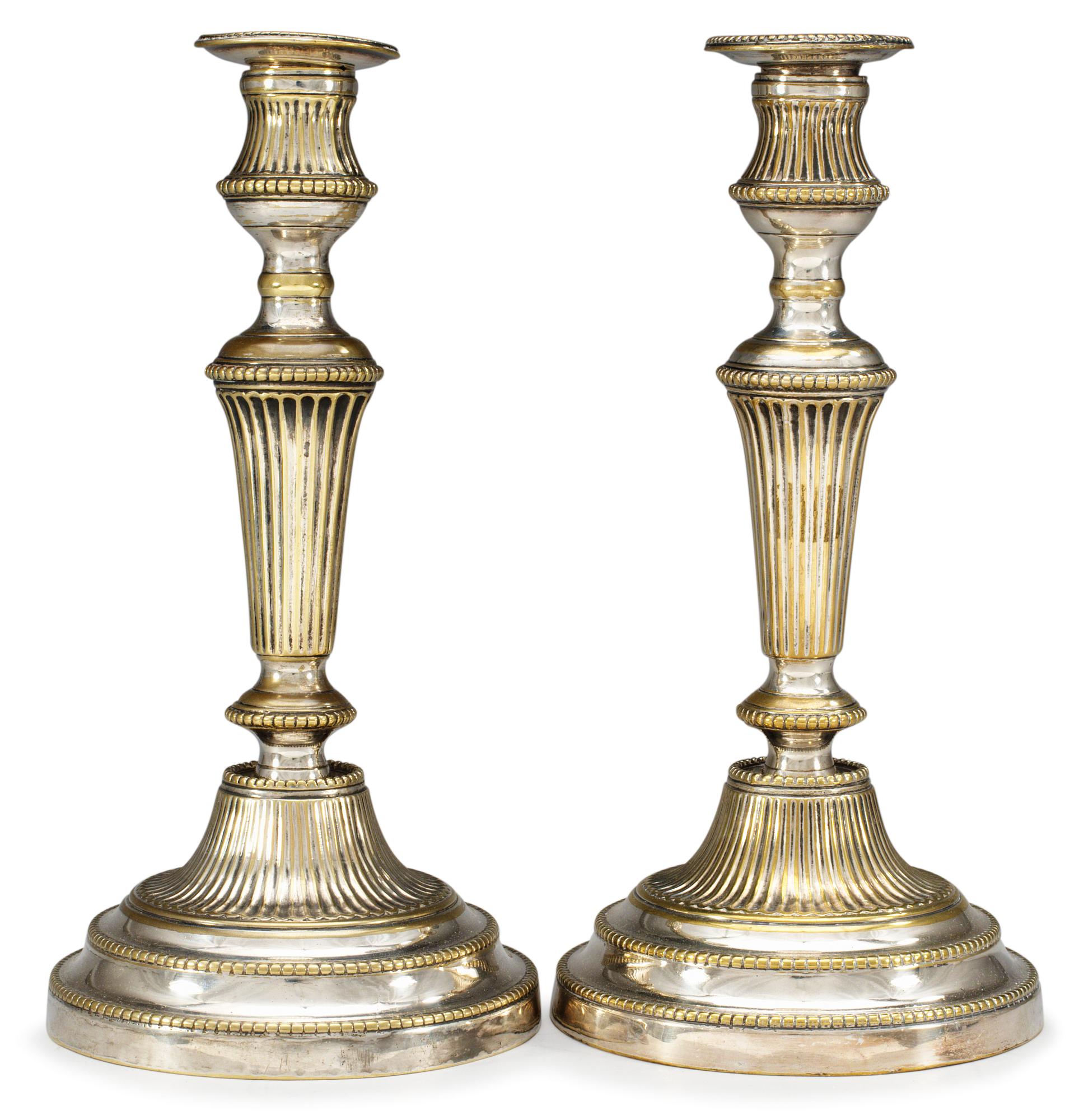 A pair of 19th century silvered candlesticks.