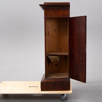 An early 19th Century empire mahogany cabinet.
