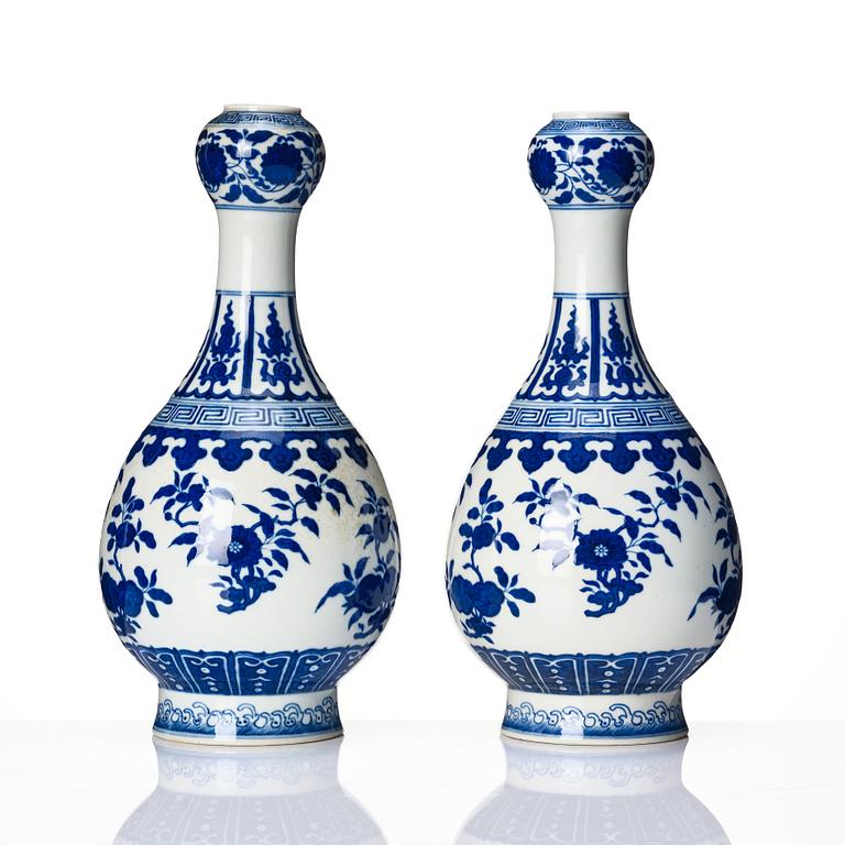 A pair of Chinese blue and white vases, late Qing dynasty/Republic with Qianlong seal mark.