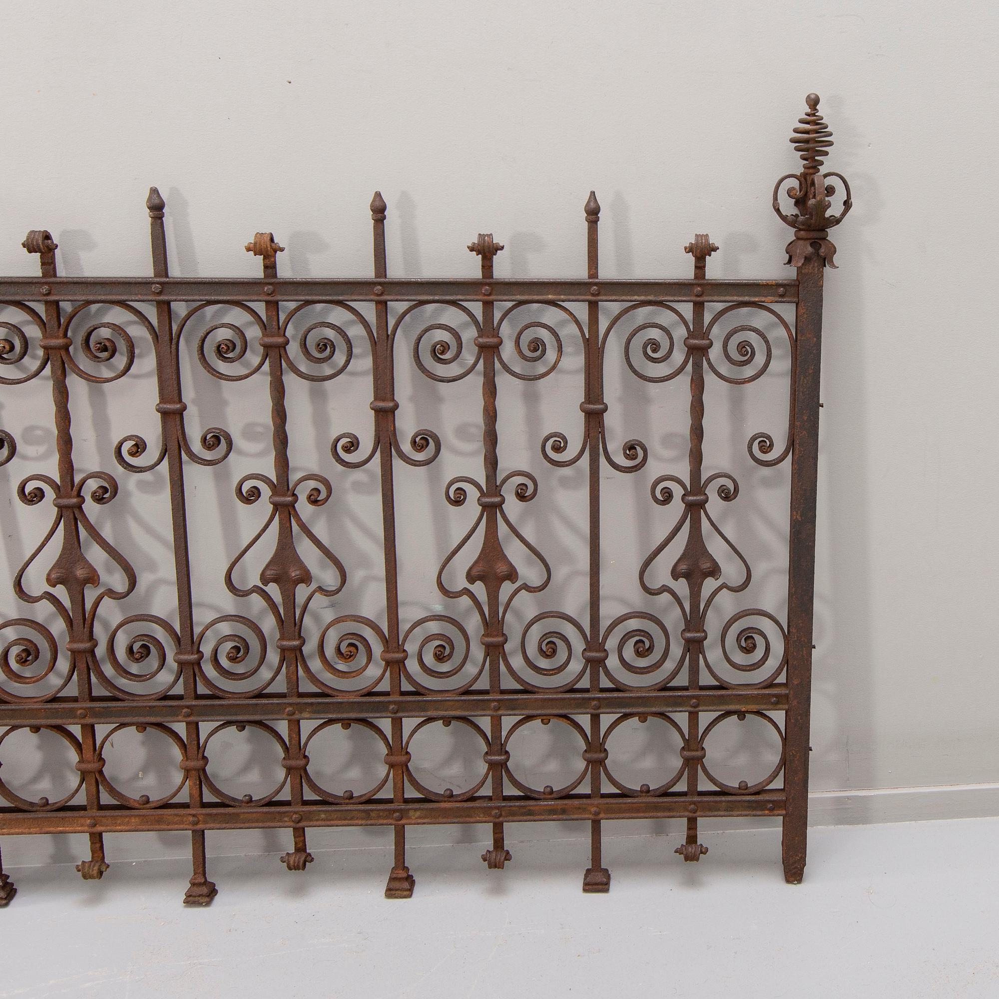 A cast iron fence around 1900.