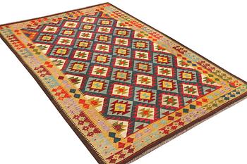 An Afghan Kelim carpet, c. 304 x 200 cm.