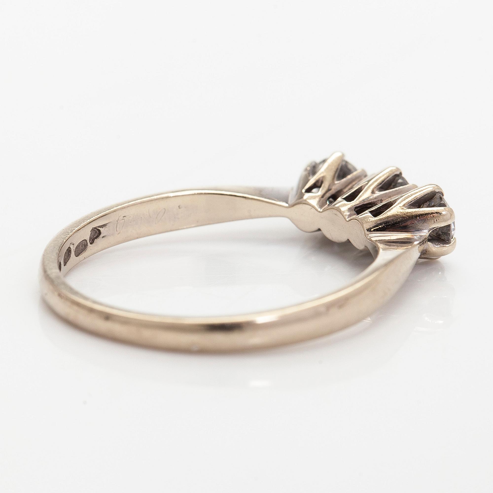 Ring, three brilliant cut diamonds, 18K white gold, H. Lahtinen & Co., 1985.
