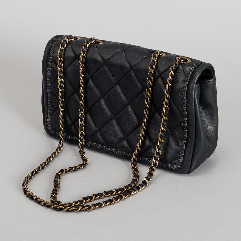 CHANEL, a black quilted fabric 'Flap Bag', 2015-2016.