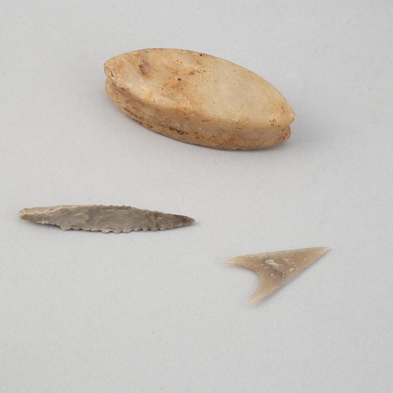 A collection of five neolithic objects.