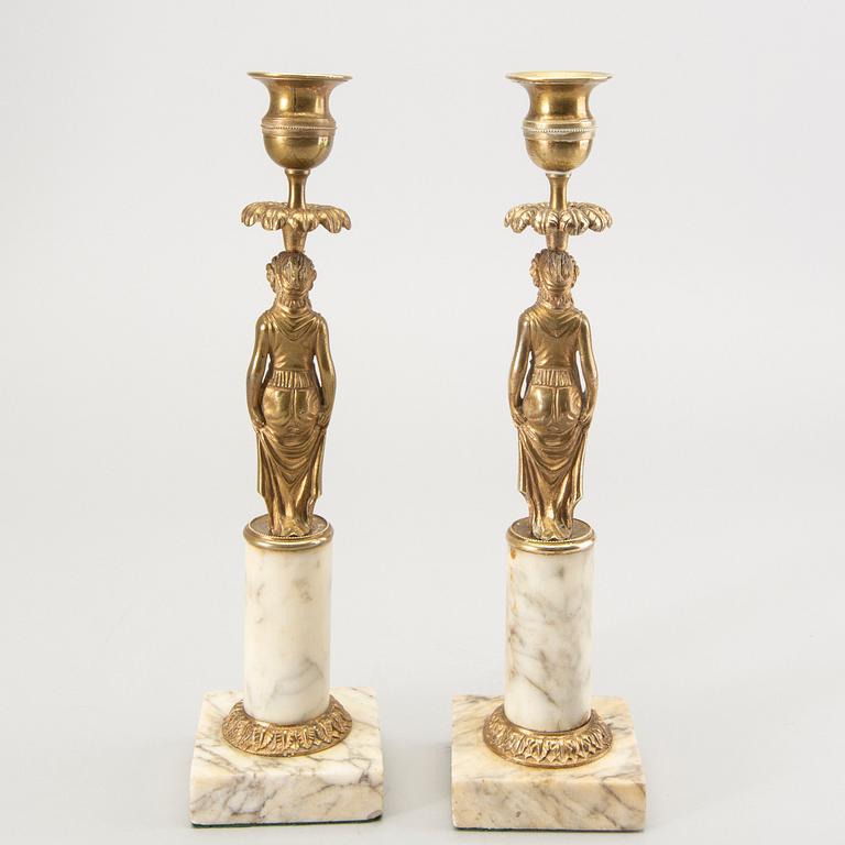 A pair of Gustavian style candle sticks around 1900.