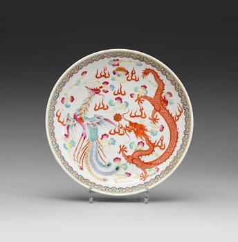 A phenix and dragon famille rose dish, Qing dynasty, with Guangxu six character mark and period (1875-1908).