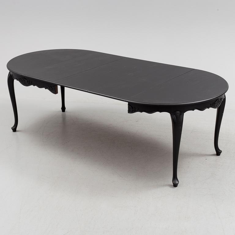 A mid 20th century rococo style dining table.