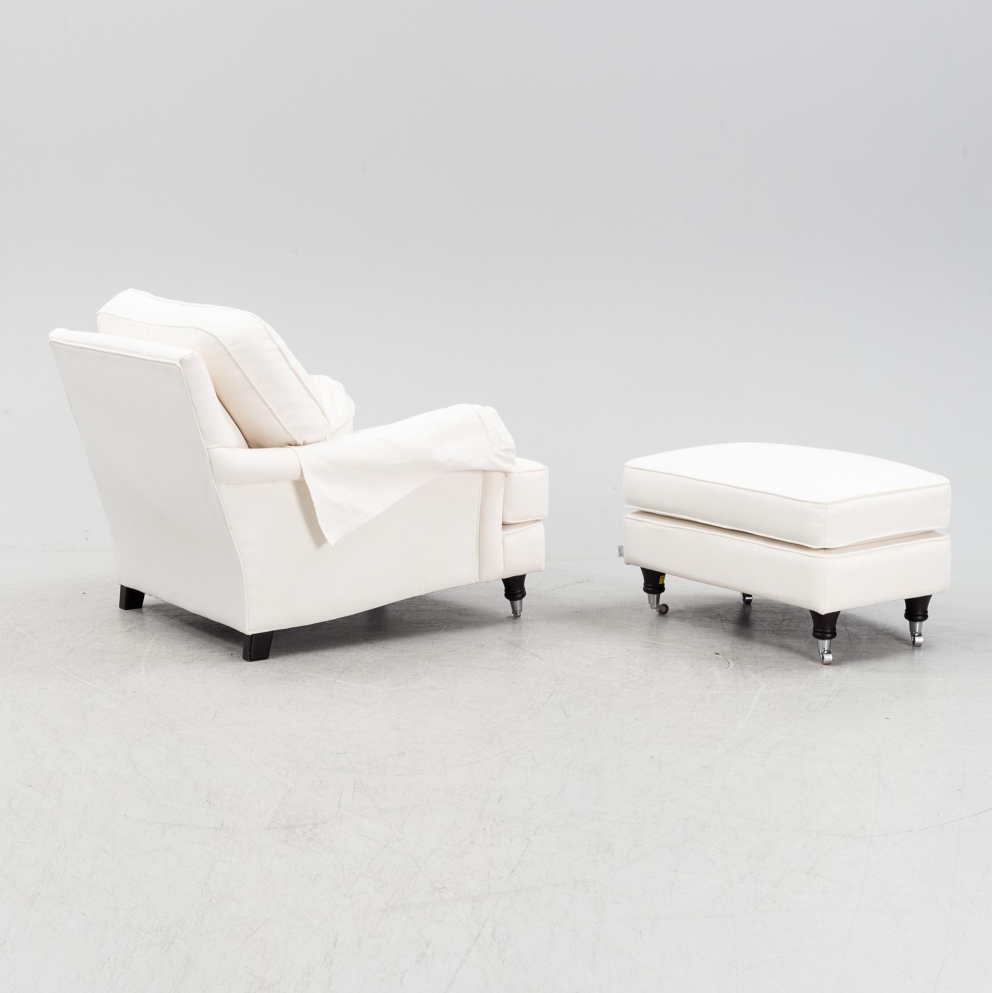 An easy chair with ottoman from Englesson, 21st century.
