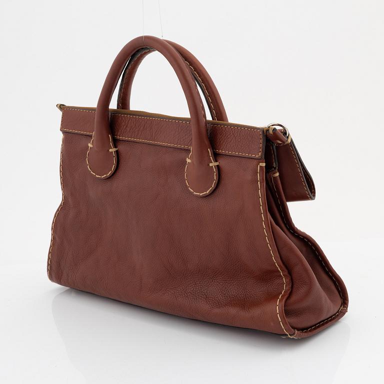 Chloé, a brown leather handbag.