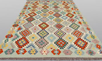 A kilim carpet, ca 294 x 208 cm.