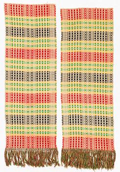 A pair of textiles, Skåne, ca 1900, each c. 190 x 68 cm.