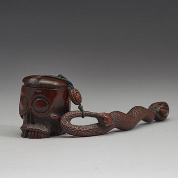 A Japanese bamboo box in the form of a skull with snake, Meiji period (1868-1912).