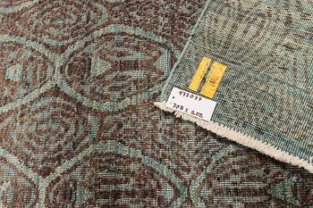 An oriental carpet with modern design, c. 308 x 202 cm.