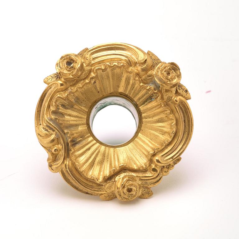 A pair of Louis XV 18th century gilt bronze candlesticks after the model by Juste-Aurèle Meissonnier.