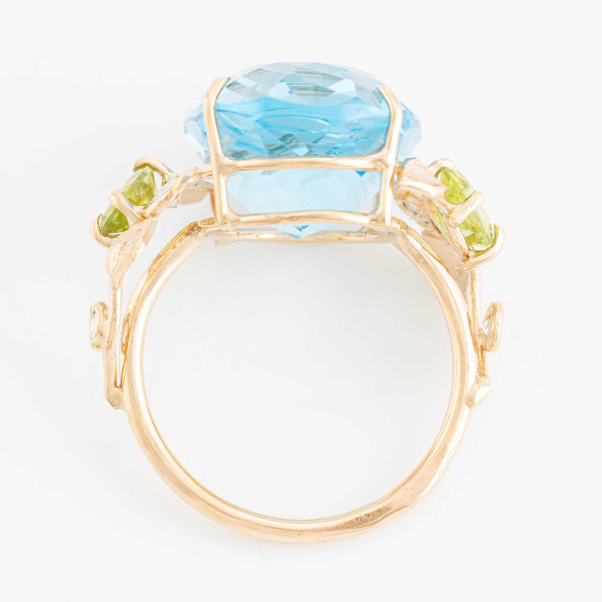 Ring, cocktail ring with blue topaz, peridot, and brilliant-cut diamonds.