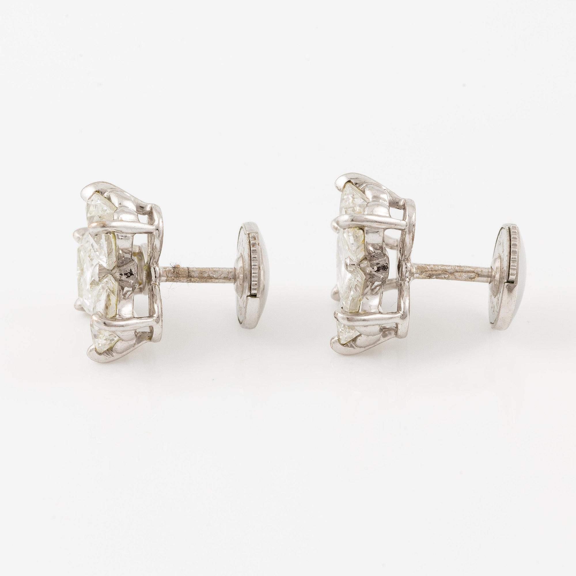 A pair of Cartier earrings in 18K white gold with six heart-shaped brilliant-cut diamonds.