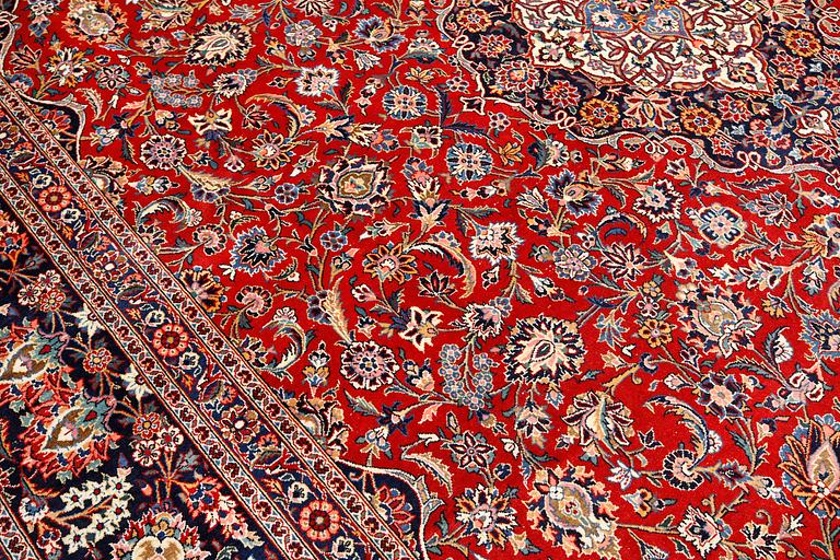 Carpet, Keshan, semi-antique, signed, 439 x 316 cm.