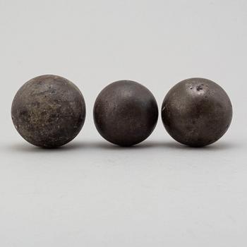 Three 19th century iron balls.