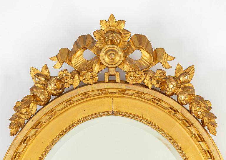 A Gustavian style mirror, mid 20th Century.