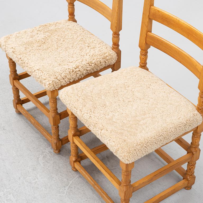 A set of eight pine chairs with new sheepskin upholstery, 1970s.