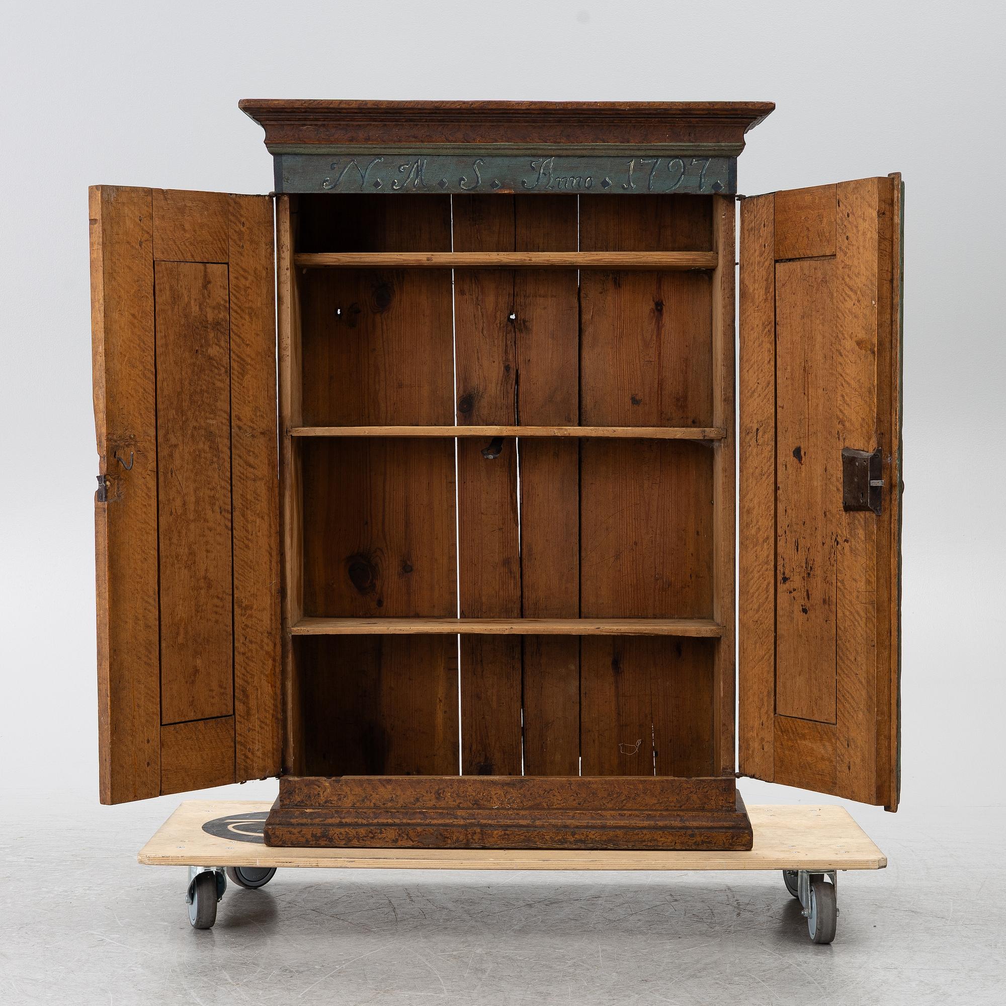 A Swedish painted cabinet,  marked 1797.