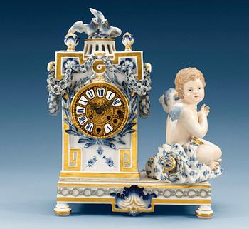1240. A Meissen table clock, ca 1900.