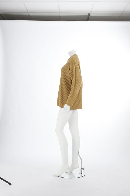 YVES SAINT LAURENT, a yellow mustard sweater, from the 1980s.