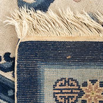 An old Chinese carpet ca 187 x 127 cm.