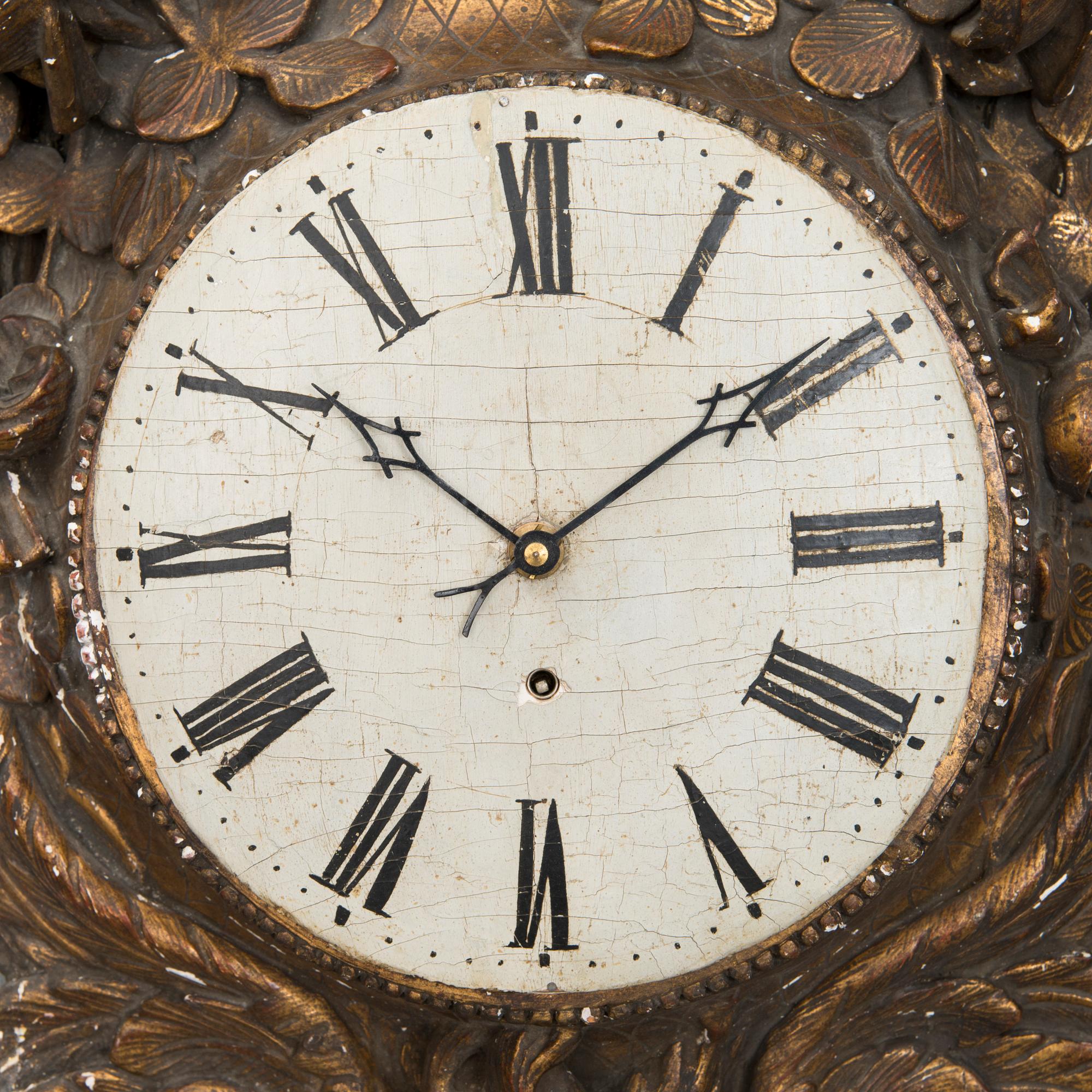 A 18th century wall clock.