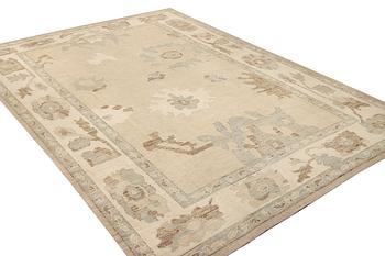 An Ushak design carpet, a. 426 x 307 cm.