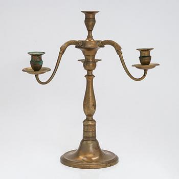 A brass candelabra signed Leander Helander 1856.