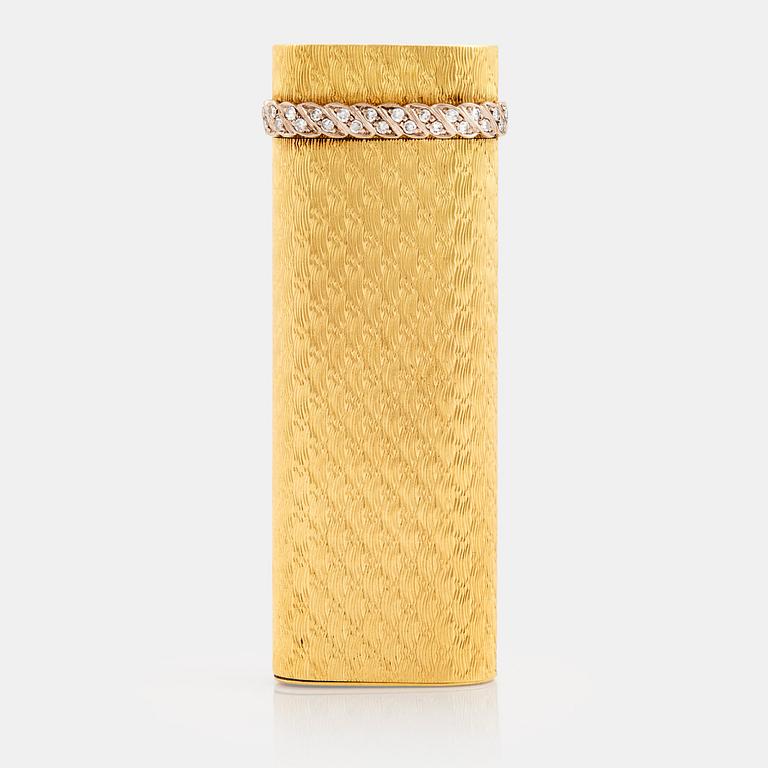 A cigarette lighter by Cartier set with single cut diamonds.