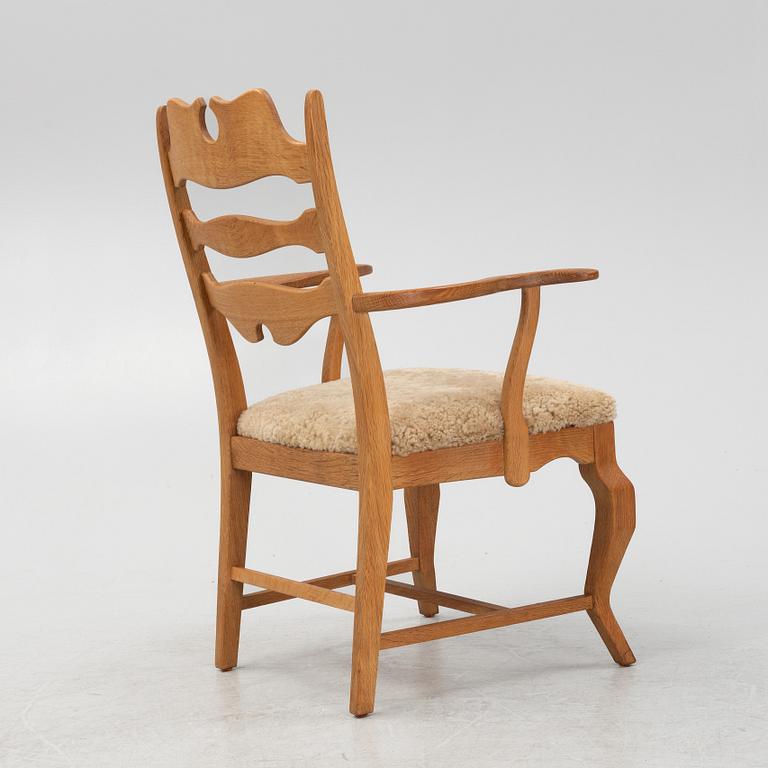 Henning Kjærnulf, an oak 'Razorblade' armchair with new sheepskin upholstery.