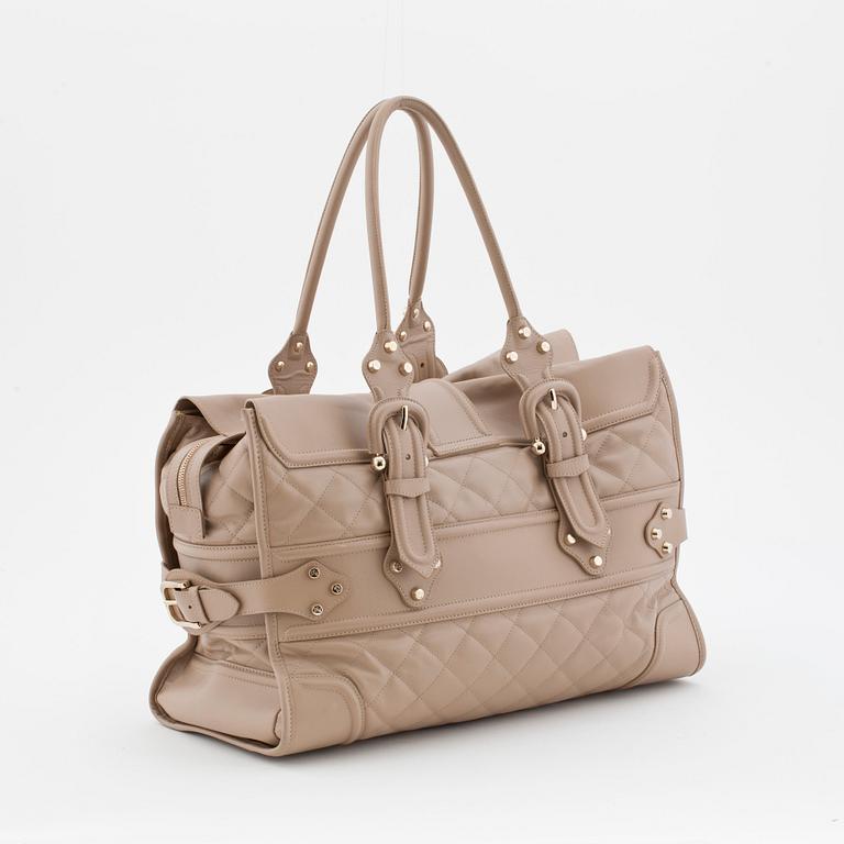 BURBERRY, a beige leather weekend bag.