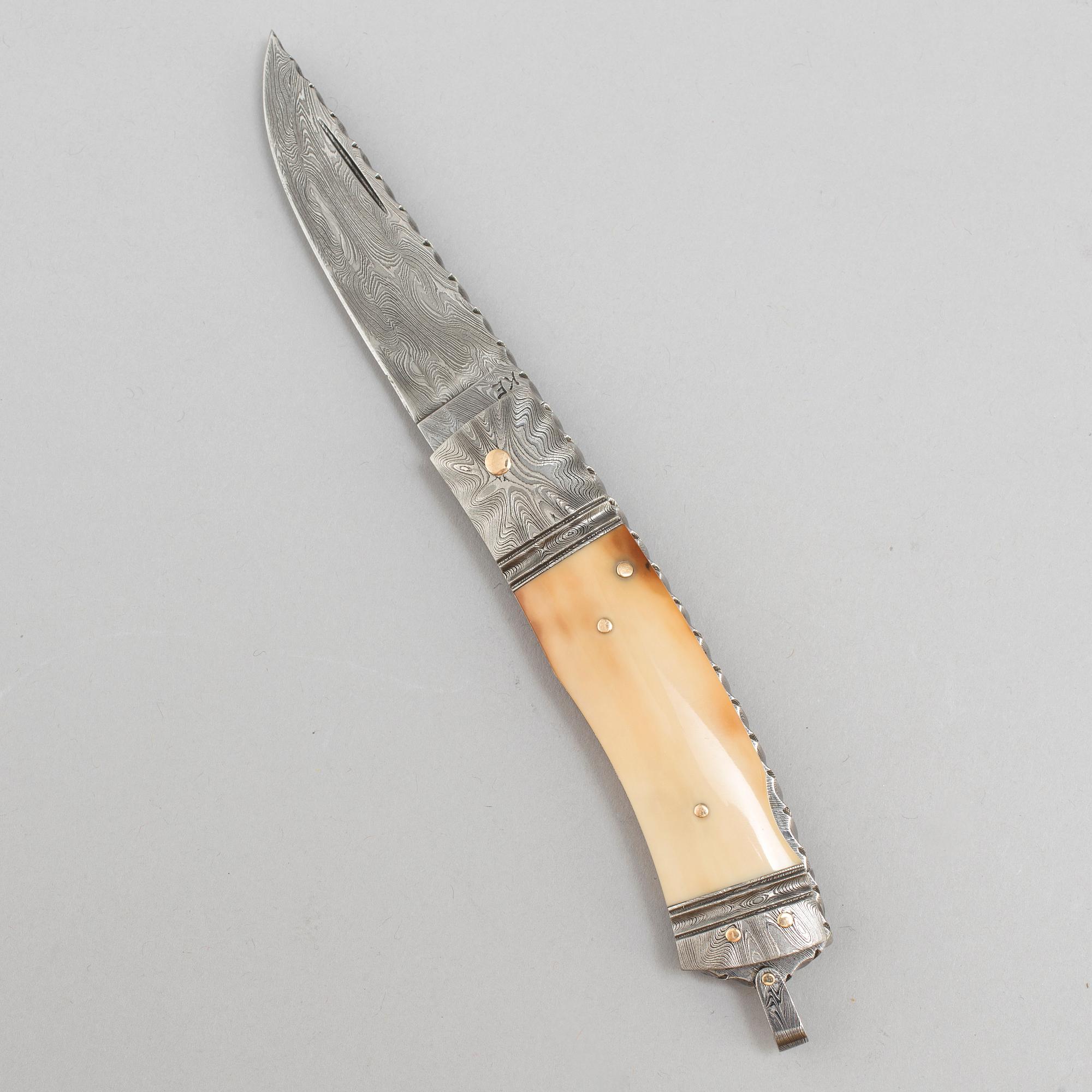 Kaj Embretsen, a damascus steel folding knife, signed.